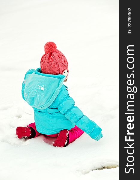 Kid playing in the snow