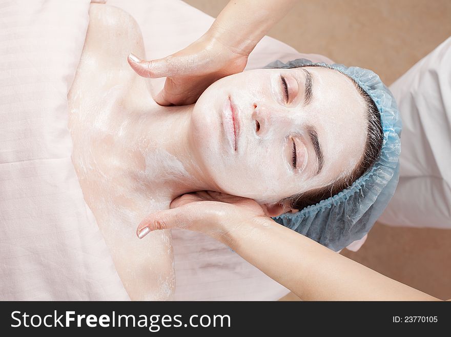 Beautiful woman with clear skin getting beauty treatment of her face at salon. Beautiful woman with clear skin getting beauty treatment of her face at salon.
