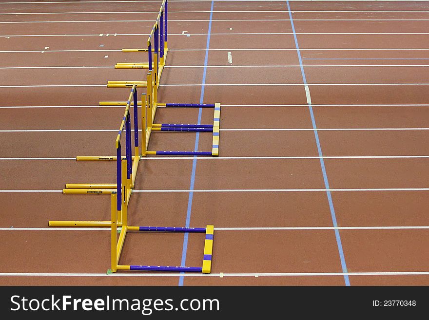 Hurdles on empty athletic's lane
