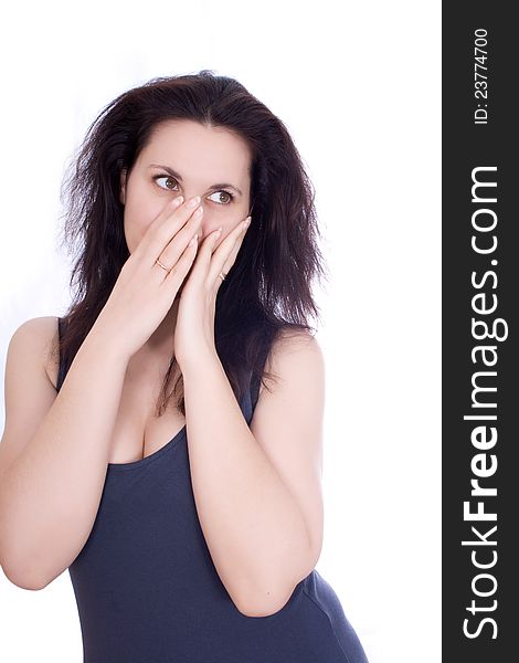 Scared woman hiding herself in her hands, isolated on white.