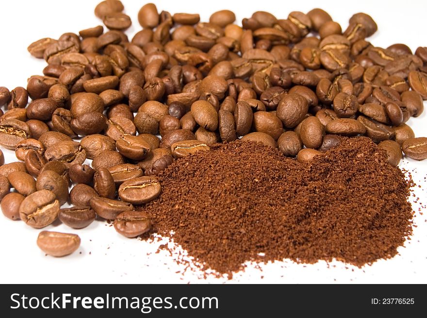 Ground coffee and beans on a white background