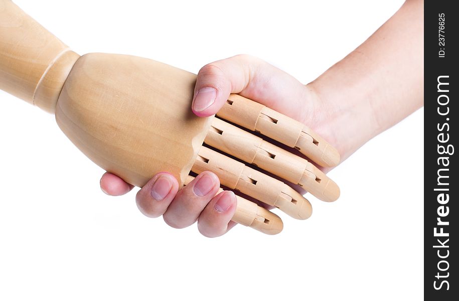 Handshake between a human hand and a wooden hand