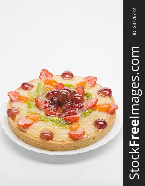 Fruit cake  on a plate over white background