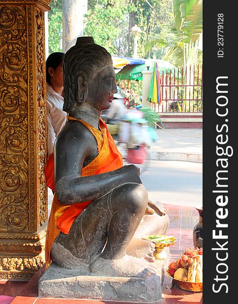 Buddha statue in buddhist sanctuary city pillar, Siemreap, Khmer Republic
