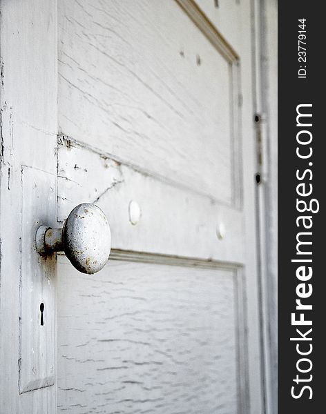 White door with a door knob close-up