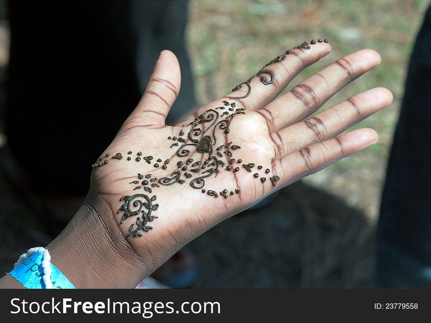 Work of tattoo artist on hand in India motif. Work of tattoo artist on hand in India motif