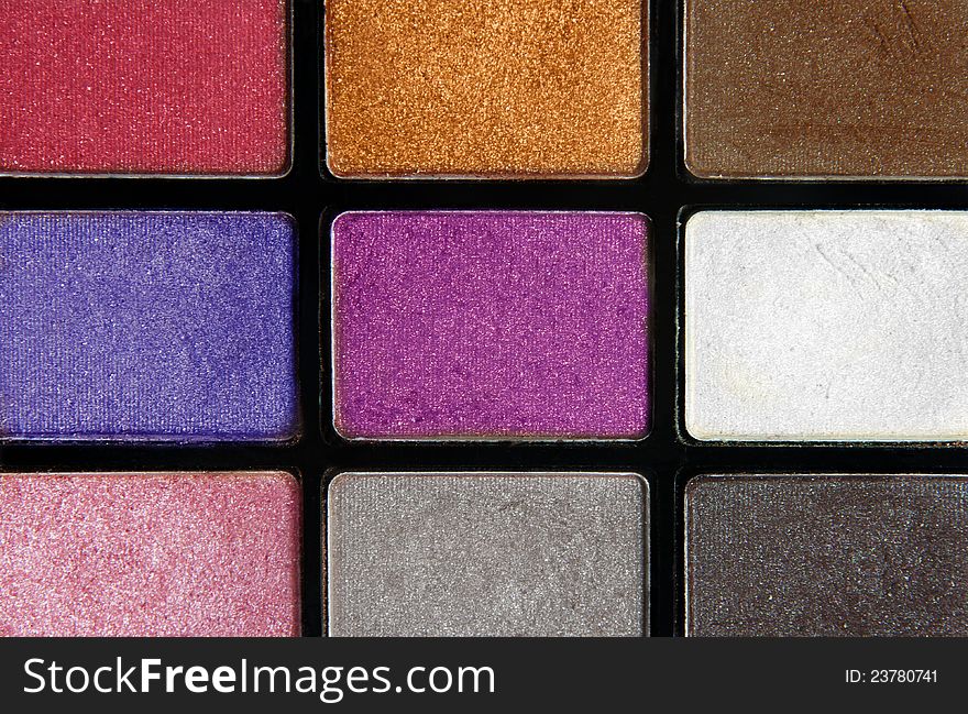 Closeup of colorful cosmetics eyeshadows. Closeup of colorful cosmetics eyeshadows