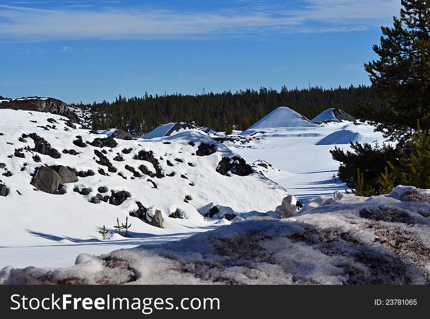 Snow covered, frozen hills and rocks