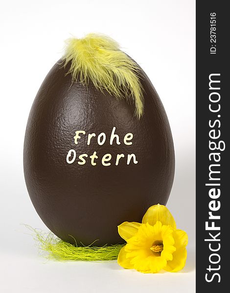 Chocolate easter egg with text: Frohe ostern. Chocolate easter egg with text: Frohe ostern