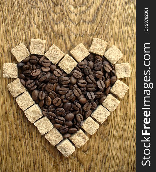 Heart shape Coffee Beans on wooden background