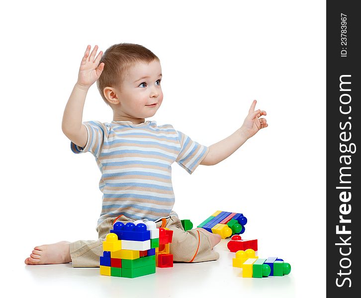 Little cheerful child with construction set over white background