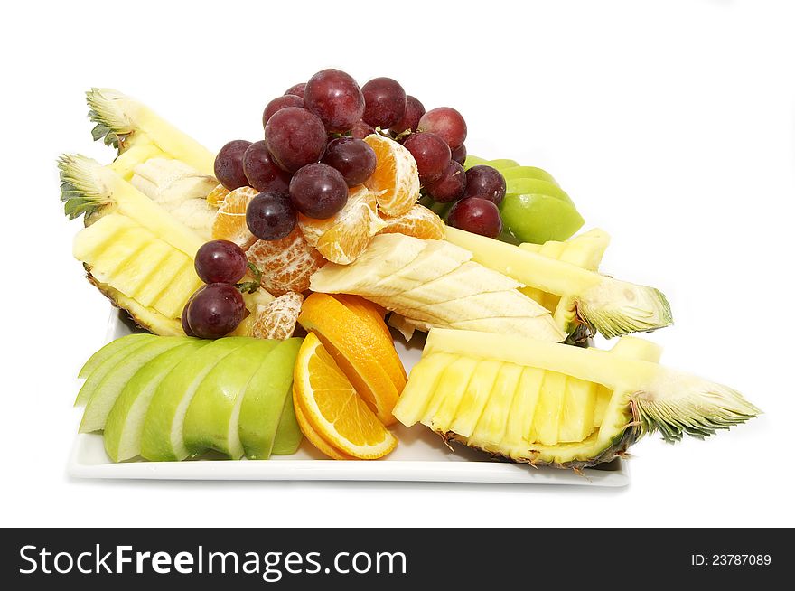 A huge bowl of fruit on a white background. A huge bowl of fruit on a white background