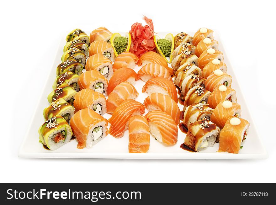 A large plate of Japanese sushi on white background