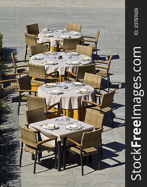 Outdoor restaurant tables at Malaga pier, Spain