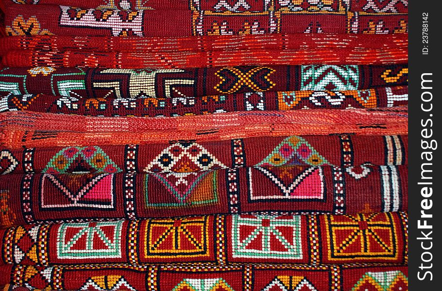 Stack of rugs in carpet sellers shop, Marrakesh Souk. Wonderful colours and geometric patterns!. Stack of rugs in carpet sellers shop, Marrakesh Souk. Wonderful colours and geometric patterns!
