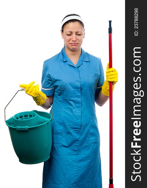 Pretty cleaning lady with bucket and broom crying isolated on white. Pretty cleaning lady with bucket and broom crying isolated on white.