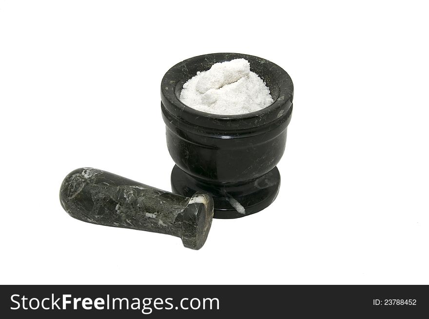 Mortar with salt for grinding food on white background