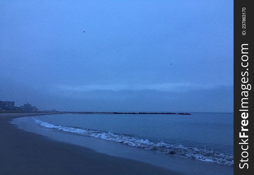 Cloudy Dawn in Winter at Coney Island in Brooklyn, New York, NY.
