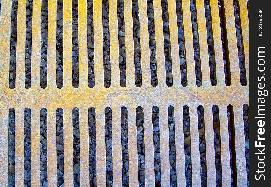 Yellowed ironwork on storm drain