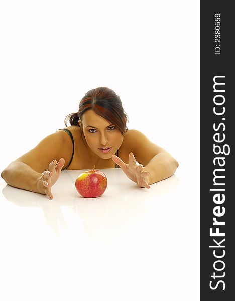 Woman exercising and red apple
