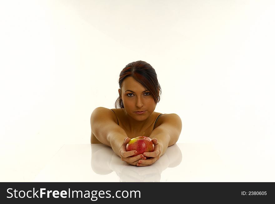 Woman exercising and red apple