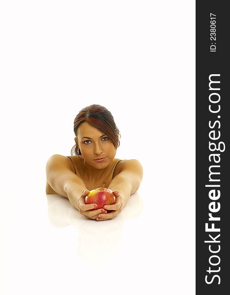 Woman exercising and red apple