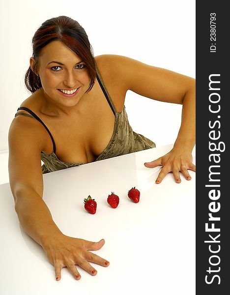 Beautiful young woman with strawberries. Beautiful young woman with strawberries.