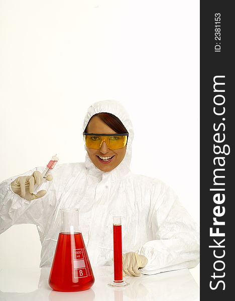 Beautiful female young scientist wearing glasses while doing a blood test. Beautiful female young scientist wearing glasses while doing a blood test