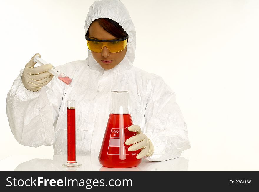 Beautiful female young scientist wearing glasses while doing a blood test. Beautiful female young scientist wearing glasses while doing a blood test