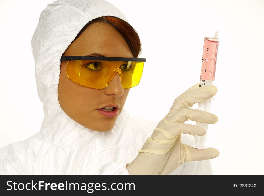 Beautiful female young scientist wearing glasses while doing a blood test. Beautiful female young scientist wearing glasses while doing a blood test