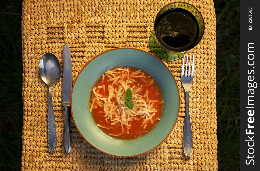 Bowl of tomato Soup with glass of vine
