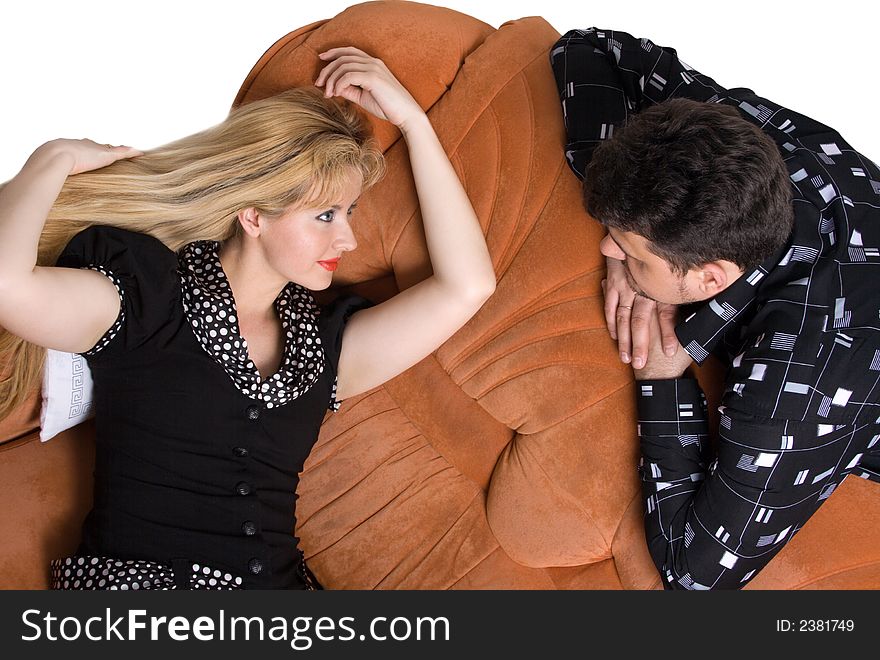 Happy adult couple on the sofa. Isolate on white. Happy adult couple on the sofa. Isolate on white