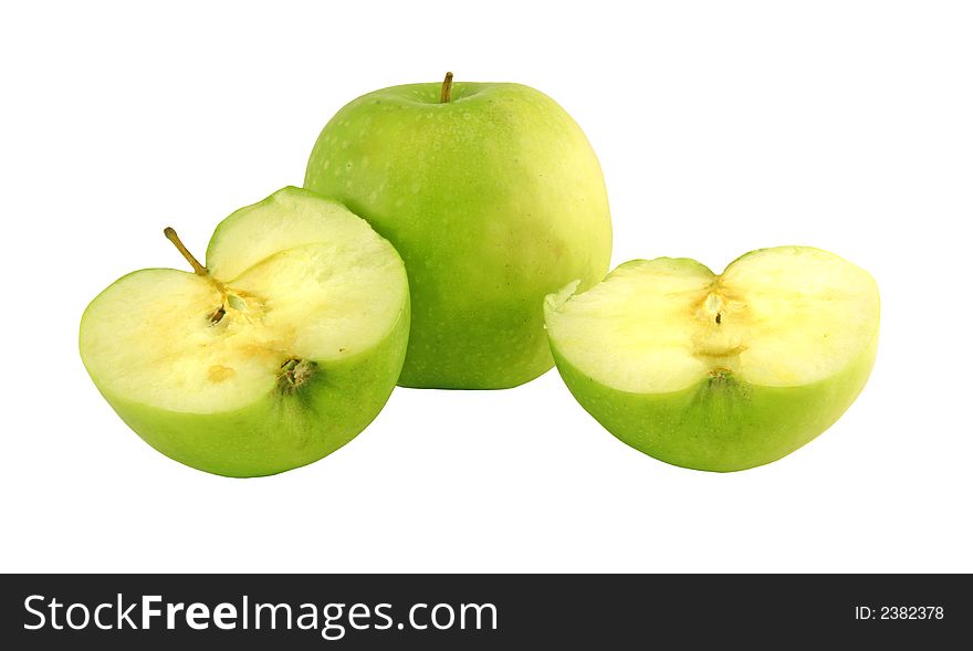 Green apple next to apples slices set on a white background