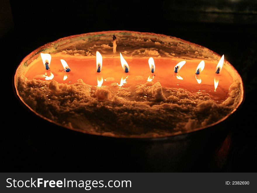 Candles in a pot of yak butter. Tibet. China. Candles in a pot of yak butter. Tibet. China