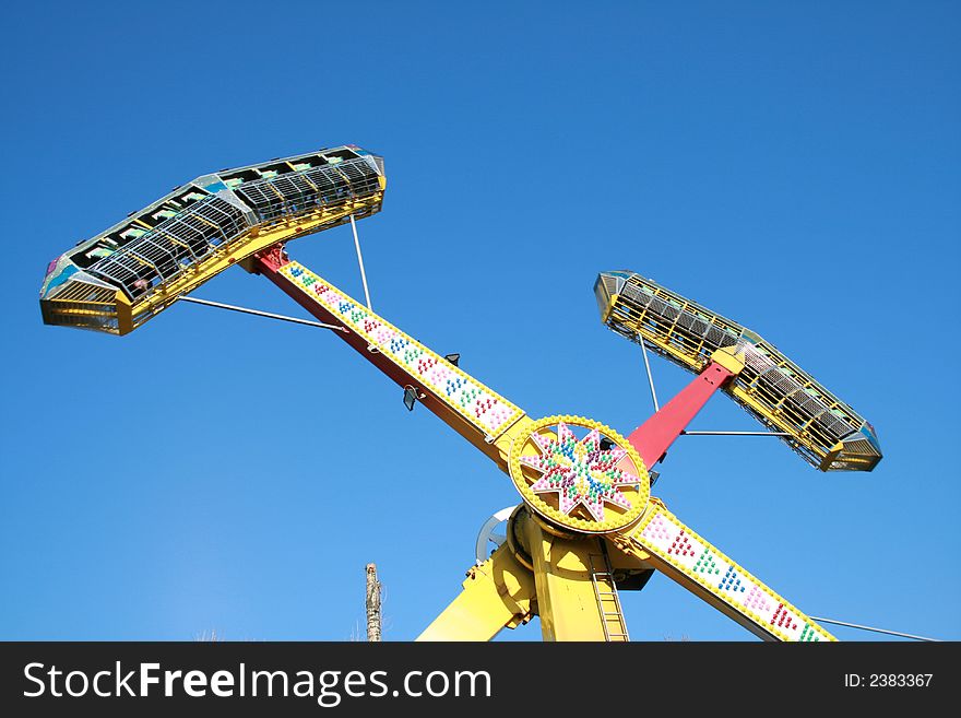 An extreme roundabout on a background of the blue sky