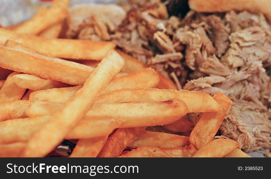 A nice lunch of barbecue and french fries. A nice lunch of barbecue and french fries