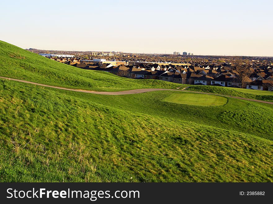 Photo of green golf course with beutiful clouds background. Photo of green golf course with beutiful clouds background