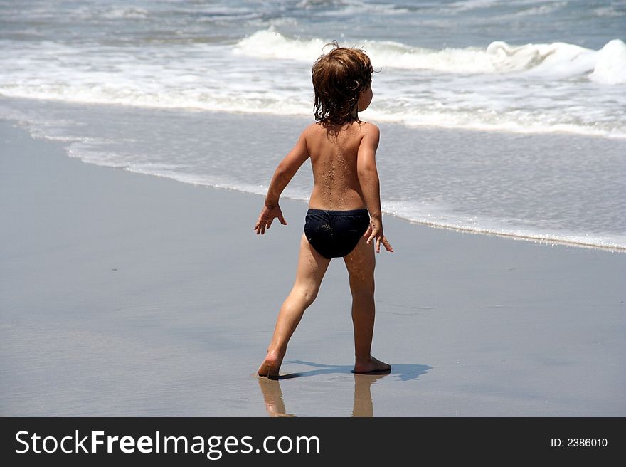 Portrait of a young boy playing on the beach. Portrait of a young boy playing on the beach