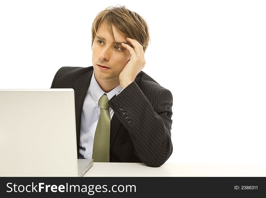 Businessman uses a laptop with frustration. Businessman uses a laptop with frustration