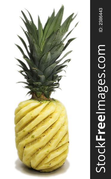 Whole sculptured pineapple isolated on white background