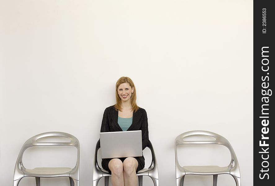 Businesswoman Sits With Laptop