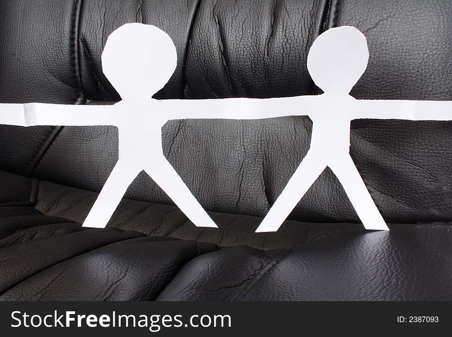 Two paper figures with black background. Two paper figures with black background