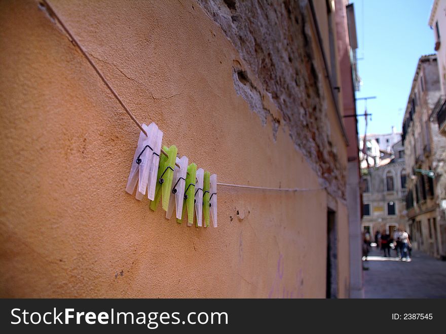 Clothes pegs hanging on a washing line. Clothes pegs hanging on a washing line