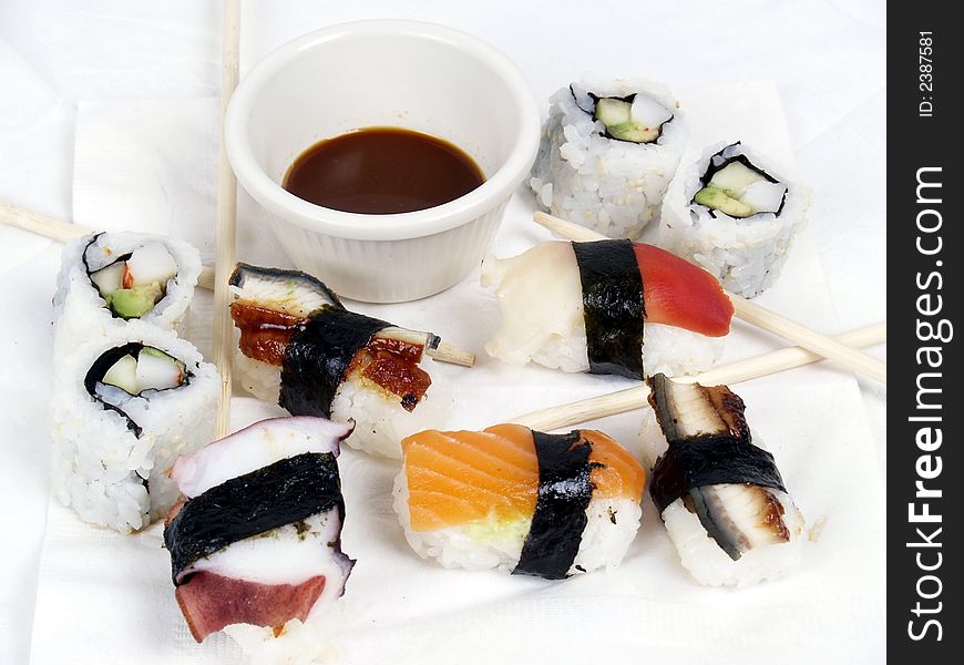 A variety of sushi appetizers ready to eat with chopsticks