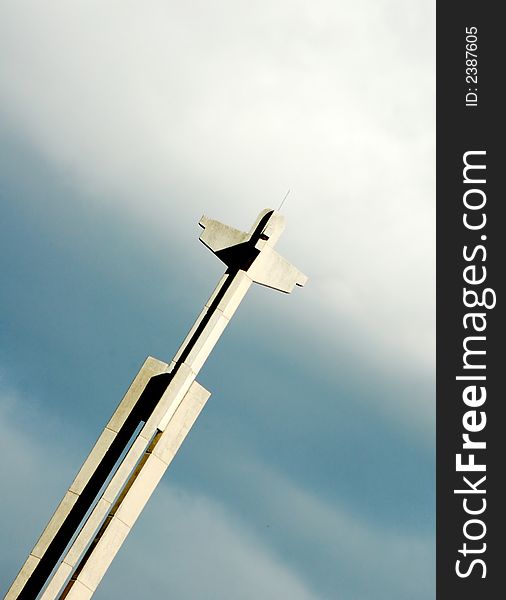 A cross against cloudy sky