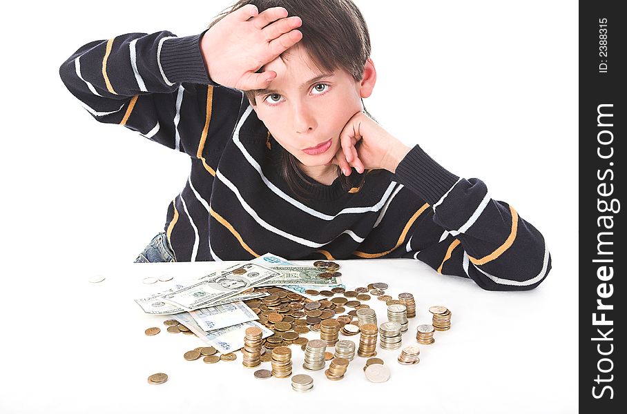 Boy considers money in piggy bank
