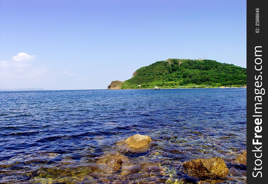Russian island in warm sea of Japan in a sunny day