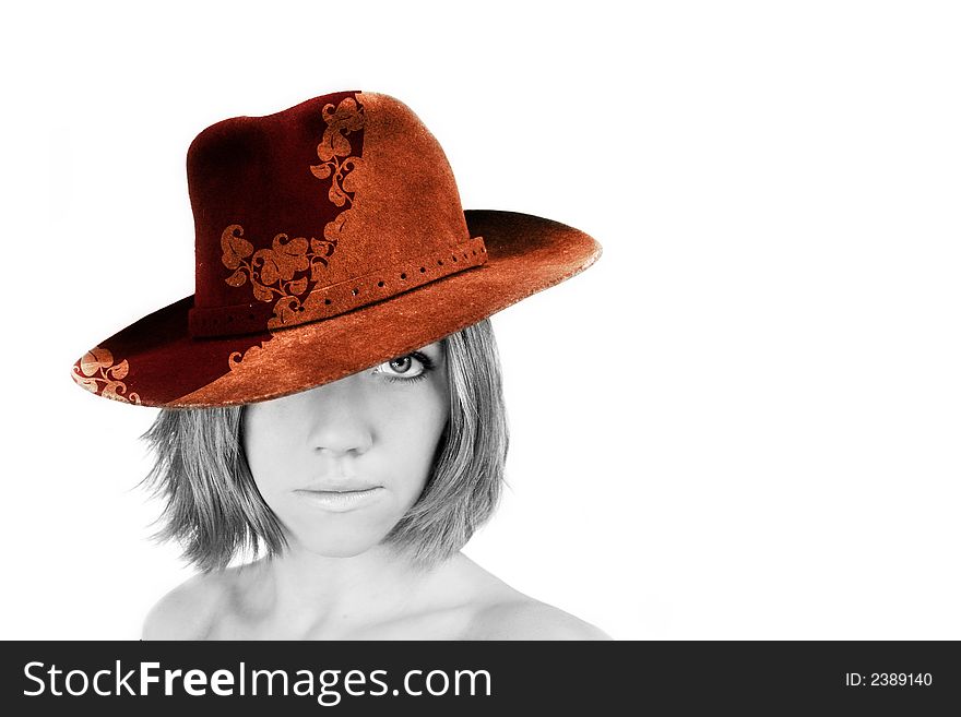 A young beautiful woman with blue eyes is wearing a cowboy hat - stetson. A young beautiful woman with blue eyes is wearing a cowboy hat - stetson