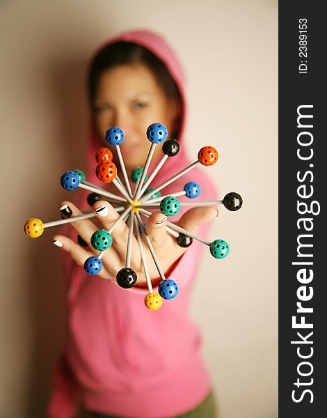 Asian girl holding onto a diagram in 3-dimensions. Asian girl holding onto a diagram in 3-dimensions