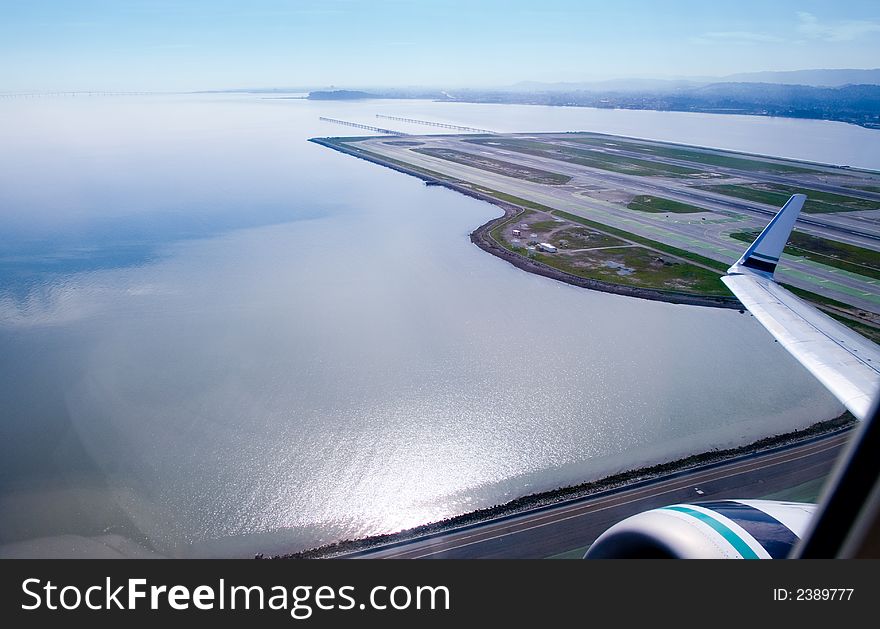 Jet leaving San Francisco international Airport, looking south over the bay. Jet leaving San Francisco international Airport, looking south over the bay